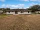 Spacious backyard, offering a large grassy area at 5803 Sw 107Th St, Ocala, FL 34476