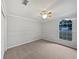 Well-lit bedroom with neutral decor and carpeted flooring at 5803 Sw 107Th St, Ocala, FL 34476