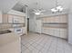 Kitchen features light-colored cabinets and ample counter space at 5803 Sw 107Th St, Ocala, FL 34476