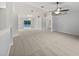 Spacious living room with high ceilings and neutral carpeting at 5803 Sw 107Th St, Ocala, FL 34476