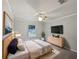 Bright bedroom with a large bed, dresser, and plenty of natural light at 5803 Sw 107Th St, Ocala, FL 34476