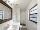 Updated bathroom with shower and vanity at 6117 Oakcrest Cir, Orlando, FL 32808