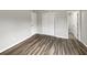 Bedroom with wood-look floors and closet at 6117 Oakcrest Cir, Orlando, FL 32808