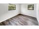 Bright bedroom featuring wood-look floors at 6117 Oakcrest Cir, Orlando, FL 32808