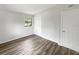 Spacious bedroom with wood-look floors and closet at 6117 Oakcrest Cir, Orlando, FL 32808