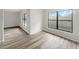 Bright bedroom with wood-look floors and windows at 6117 Oakcrest Cir, Orlando, FL 32808