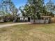 Updated home with a landscaped lawn and driveway at 6117 Oakcrest Cir, Orlando, FL 32808