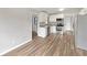 Updated kitchen featuring white cabinets and wood-look flooring at 6117 Oakcrest Cir, Orlando, FL 32808