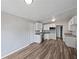 This kitchen features stainless steel appliances, lots of light, and wood floors at 6117 Oakcrest Cir, Orlando, FL 32808