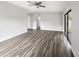 Living room with wood-look floors and sliding doors at 6117 Oakcrest Cir, Orlando, FL 32808