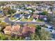 Aerial view of a residential neighborhood with houses and a lake at 626 Brookfield Loop, Lake Mary, FL 32746