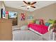 Bright bedroom with daybed and ample closet space at 626 Brookfield Loop, Lake Mary, FL 32746