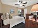 Charming bedroom with ceiling fan and built-in shelving at 626 Brookfield Loop, Lake Mary, FL 32746