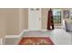 Light and airy entryway featuring tile floors and a patterned rug at 626 Brookfield Loop, Lake Mary, FL 32746