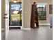 Bright entryway with tile flooring and a wooden shelving unit at 626 Brookfield Loop, Lake Mary, FL 32746