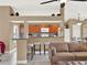 Well-equipped kitchen with wood cabinets and tile floors at 626 Brookfield Loop, Lake Mary, FL 32746