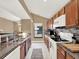 Bright kitchen boasts granite countertops and modern appliances at 626 Brookfield Loop, Lake Mary, FL 32746