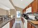 Bright kitchen boasts granite countertops and modern appliances at 626 Brookfield Loop, Lake Mary, FL 32746