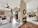 Spacious living room with tile floors and a view into the kitchen at 626 Brookfield Loop, Lake Mary, FL 32746