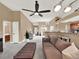 Living area features a sectional sofa and access to kitchen and bathroom at 626 Brookfield Loop, Lake Mary, FL 32746