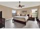 Relaxing main bedroom with ceiling fan and large windows at 626 Brookfield Loop, Lake Mary, FL 32746