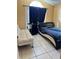 Bedroom with a queen-size bed, a sofa bed and large window at 6868 Westlake Blvd, Orlando, FL 32810