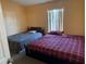 Bedroom with two beds and window at 6868 Westlake Blvd, Orlando, FL 32810