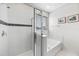 Bathroom with walk-in shower and soaking tub at 9030 Sunshine Ridge Loop, Kissimmee, FL 34747