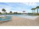 Community pool with plenty of lounge chairs and a fun water feature for  at 9030 Sunshine Ridge Loop, Kissimmee, FL 34747