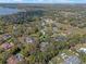 Aerial view shows the location of the property nestled in a lush, green community near a lake at 9501 Hempel Cove Blvd, Windermere, FL 34786