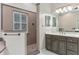 This bathroom boasts dual vanities, tile floors, and a glass shower at 9501 Hempel Cove Blvd, Windermere, FL 34786
