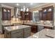 Gourmet kitchen with a stainless steel range, a decorative backsplash, and granite counters at 9501 Hempel Cove Blvd, Windermere, FL 34786