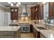 Gourmet kitchen features a large island, custom cabinetry, granite countertops, and stainless steel appliances at 9501 Hempel Cove Blvd, Windermere, FL 34786