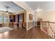 View of a living room featuring wood floors and a custom built-in bookshelf at 9501 Hempel Cove Blvd, Windermere, FL 34786