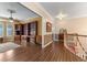 The living room offers hardwood floors, ceiling fan, and a large bookshelf, creating a cozy and organized space at 9501 Hempel Cove Blvd, Windermere, FL 34786