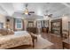 This main bedroom boasts an ensuite bathroom, fireplace, trey ceiling, and hardwood floors at 9501 Hempel Cove Blvd, Windermere, FL 34786
