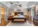 This bright main bedroom has a trey ceiling, hardwood floors, and ample space at 9501 Hempel Cove Blvd, Windermere, FL 34786