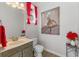 Stylish powder room with modern vanity, elegant mirror, and fashionable decor, creating a chic space at 9501 Hempel Cove Blvd, Windermere, FL 34786