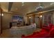 Entertainment goals! Private theater room with a large screen, projector, comfortable seating, and custom details at 9501 Hempel Cove Blvd, Windermere, FL 34786