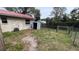 Backyard with storage shed and chain link fence at 990 Liskeard Ave, Orange City, FL 32763