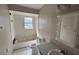 Bathroom with tub, toilet, and vanity, needs updating at 990 Liskeard Ave, Orange City, FL 32763