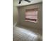 Empty bedroom with ceiling fan and tiled floors at 990 Liskeard Ave, Orange City, FL 32763