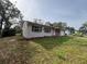 Brick and stucco ranch home with a carport and spacious yard at 990 Liskeard Ave, Orange City, FL 32763
