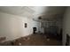 Attached garage with overhead door and ample storage space at 990 Liskeard Ave, Orange City, FL 32763