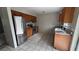 Efficient kitchen with stainless steel refrigerator and stove at 990 Liskeard Ave, Orange City, FL 32763