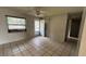 Spacious living room with tile floors and neutral walls at 990 Liskeard Ave, Orange City, FL 32763