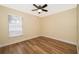 Spacious bedroom with ceiling fan and wood-look flooring at 245 Heronwood Cir, Deltona, FL 32725