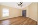 Spacious bedroom with wood-look floors and sliding glass doors at 245 Heronwood Cir, Deltona, FL 32725