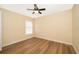 Bright bedroom featuring a ceiling fan and new flooring at 245 Heronwood Cir, Deltona, FL 32725
