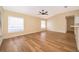 Bright living room with wood-look floors and large window at 245 Heronwood Cir, Deltona, FL 32725